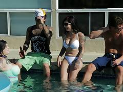 A tattooed babes meets a guy a pool party and ends up fucking him