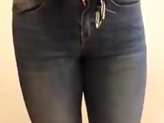 Despairing and wetting in padlocked spray-on-slender jeans