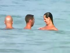 Voyeur tapes a girl sucking her bf's cock on a nude beach