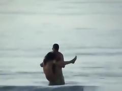 Voyeur tapes a crazy couple having sex in the sea