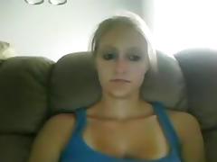 Busty blonde girl with tanlines masturbates with a vibrator on the sofa