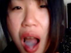 Asian babe jerking and sucking