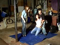 Women hogtied and gagged in Garage