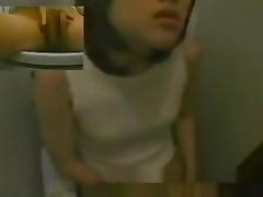 Cutie on toilet cam is sliding the finger between pussy lips
