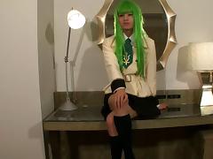 Sexy green wig on a Japanese tranny fingering her asshole