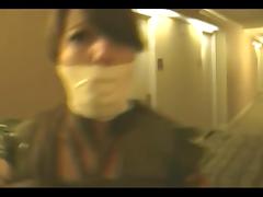 Tied Slave helpless in hotel hallway