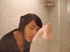Girl plays with her dildo in the shower