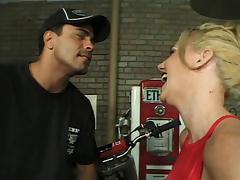 Blonde chick riding on a long shaft while sucking the other one
