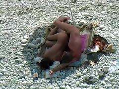 Voyeur captures couple secretly fucking at a nudist beach