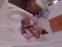 HIDDEN CAMERA catches stacked MILF masturbating in tub
