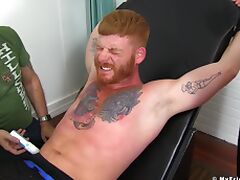 Tattooed stud can't endure getting his feet tickled by a perv