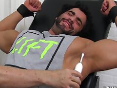 Foot fetish video of a muscular stud enjoying while a perv tickles him