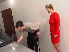 Mature On a Red Outfit Fucking A Young Cock In The Garage