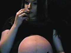 Pregnant slut is smoking in the room