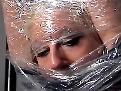 Pretty girl wrapped in plastic