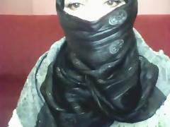 Bored arab hotty in hijab plays on her computer