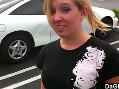A hot blonde gives a blowjob to her boyfriend in a car