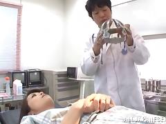 A doctor tests his Asian patient by teasing her tits and toying her pussy